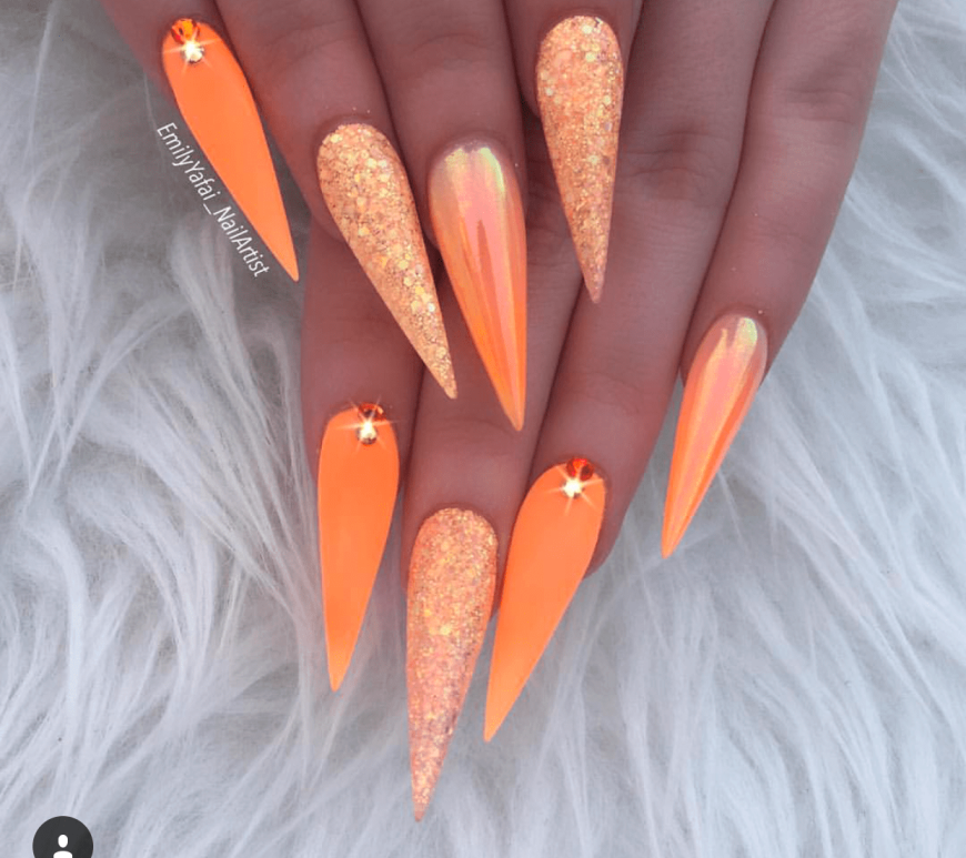 Orange Acrylic and glitter stiletto nails